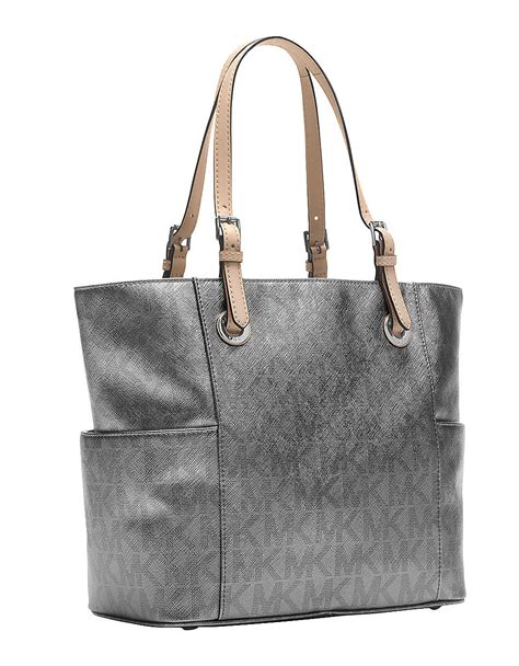 silver michael kors bag with pockets